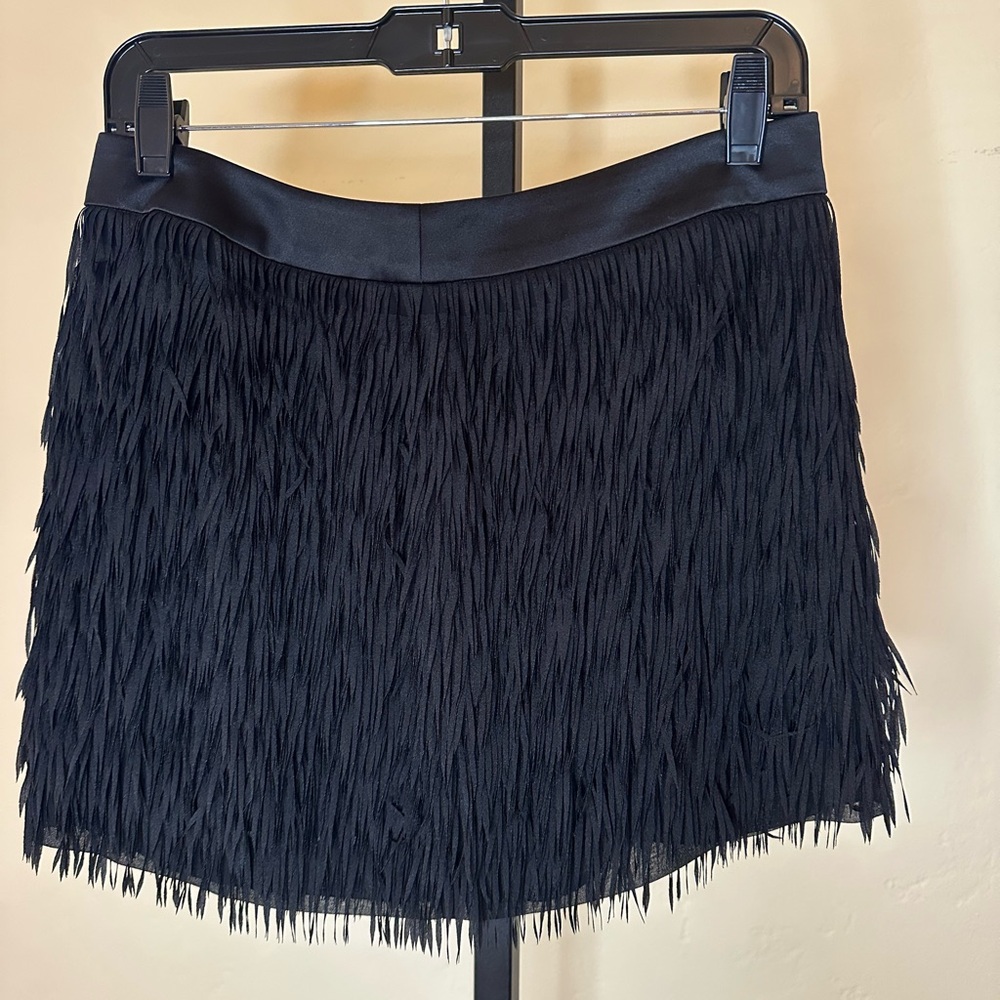 Black fringe vintage miniskirt. Polyester. Best for 4/6. 14” long. Zip in, lined